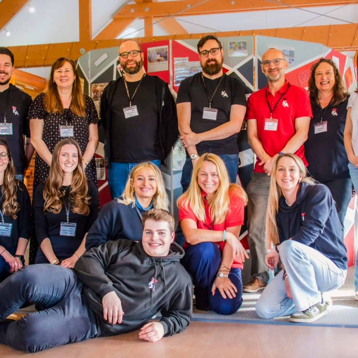 Team from The King’s Arms community youth project posing together indoors.