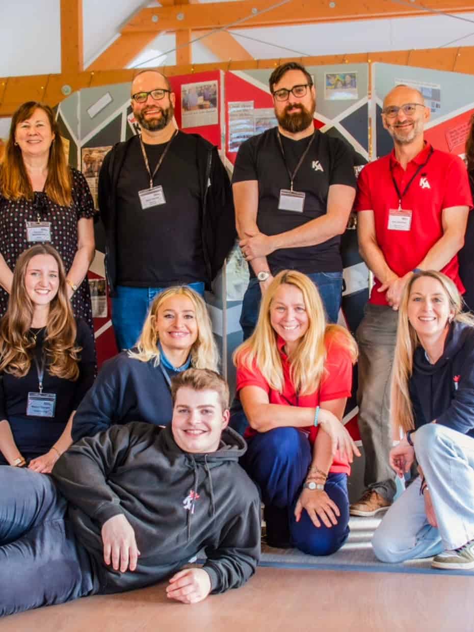 Team from The King’s Arms community youth project posing together indoors.